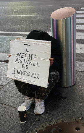 NEW YORK - MARCH 14, 2020: Homeless man ask for donation in midtown Manhattan. Today, more New...