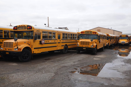 BROOKLYN, NEW YORK - MARCH 19, 2020: School buses parked on the yard in Brooklyn, NY after New York...
