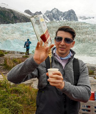 TIERRA DEL FUEGO, CHILE - FEBRUARY 2, 2020: Bartender from Ventus Australis expedition ship on the shore near Pia glacier in Parque Nacional Alberto de Agostini in Patagoniaのeditorial素材