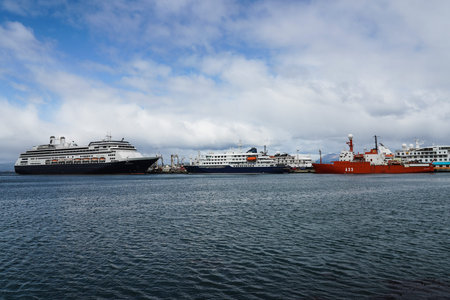 USHUAIA, ARGENTINA  - FEBRUARY 5, 2020: Holland America Cruise Ship Amsterdam (L) Polar Cruises Ship Hondius and Spanish polar research vessel BIO Hesperides docked in Ushuaia, Argentina.のeditorial素材
