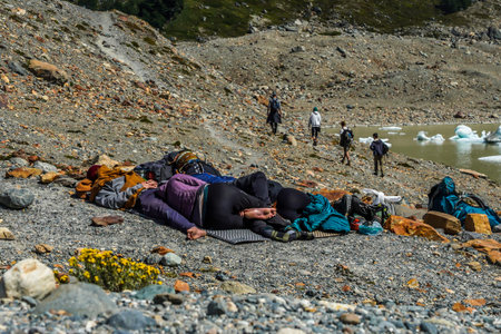 EL CHALTEN, ARGENTINA  - FEBRUARY 6, 2020: Adventure tourists rests at the Laguna Torre trail in the Los Glaciares National Park, Santa Cruz Province, Argentinaのeditorial素材