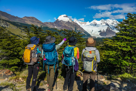 EL CHALTEN, ARGENTINA  - FEBRUARY 6, 2020: Japanese tourists enjoy  view of Cerro Torre Mountain at the Laguna Torre trek in the Los Glaciares National Park, Argentinaのeditorial素材