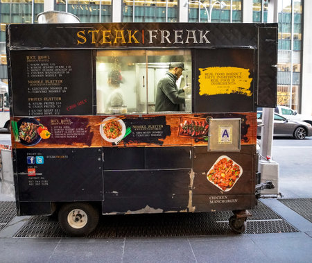 NEW YORK - DECEMBER 5, 2019: Street food vendor cart in Manhattan. There are about 4,000 mobile food vendors licensed by the cityのeditorial素材