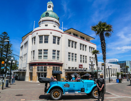 NAPIER, NEW ZEALAND -JANUARY 29, 2019: The Dome in the T&G Building and vintage car in Napier, New Zealand. Landmark Art Deco building by Atkin & Mitchell, Wellington, 1936 for the T & G Mutual Lifeのeditorial素材