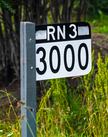 Signpost 3000 km till the end in Buenos Aires at the National Route 3 (Ruta Nacional 3) road sign in...