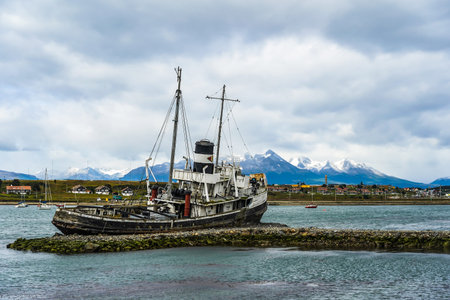 USHUAIA, ARGENTINA - FEBRUARY 5, 2020: The wreck of Saint Christopher aground in the harbor of Ushuaia. The Saint Christopher is an American-built rescue tug that served in British Royal Navy in WWIIのeditorial素材