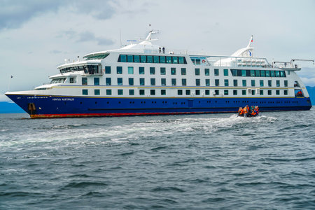 TUCKERS ISLETS, CHILE - FEBRUARY 1, 2020: Tourists disembark from cruise ship "Ventus Australis" at Tuckers Islets during fjords of Tierra del Fuego expedition cruiseのeditorial素材