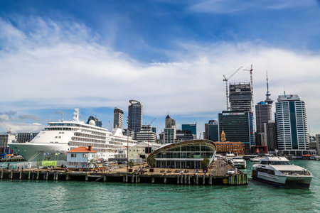 AUCKLAND, NEW ZEALAND - JANUARY 29, 2019: Silversea's Silver Whisper Cruise Ship at the Auckland Ferry Terminal in Auckland Harbor. It is the hub of the Auckland ferry network that connects city with suburbs and islandsのeditorial素材