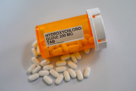 Pharmacy bottle with Hydroxychloroquine pills generic to Plaquenil. NIH begins clinical trial of...