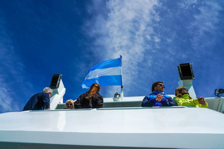 EL CALAFATE, ARGENTINA - FEBRUARY, 8, 2020: Visitors enjoy Lake Argentino cruise to see the...