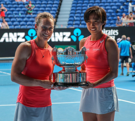MELBOURNE, AUSTRALIA - JANUARY 25, 2019: Grand Slam champions Samantha Stosur of Australia (L) and Zhang Shuai of China during trophy presentation after 2019 Australian Open doubles final match at Rod Laver Arenaのeditorial素材