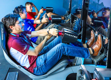 NEW YORK - JULY 13, 2019: Gamers enjoy Playseat Formula E new racing simulator inside the Gaming Arena during 2019 New York City E-Prix at Red Hook in Brooklynのeditorial素材