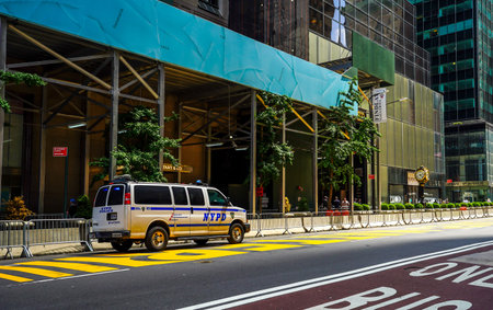NEW YORK - JULY 16, 2020: New York Police Department  protects Black Lives Matter mural on 5th...