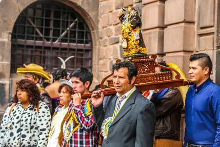CUSCO, PERU - OCTOBER 4, 2016: Unidentified participants in traditional clothes celebrate religious festivity in front of the Cathedral (Convent) of Santo Domingo in Cusco, Peruのeditorial素材