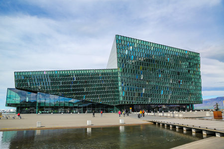 REYKJAVIK, ICELAND - JULY 3, 2016: Harpa concert hall and opera house in Reykjavik, Iceland. A distinctive colored glass facade inspired by the basalt landscape of Icelandのeditorial素材