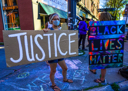 SARATOGA SPRINGS, NEW YORK  - AUGUST 3, 2020: Black Lives Matter and Defund Police  Protesters in front of City Hall in Saratoga Springs, NYのeditorial素材