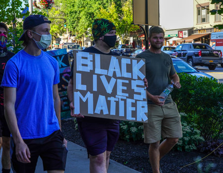 SARATOGA SPRINGS, NEW YORK  - AUGUST 3, 2020: Black Lives Matter and Defund Police  Protesters in front of Saratoga Springs, NY City Hallのeditorial素材