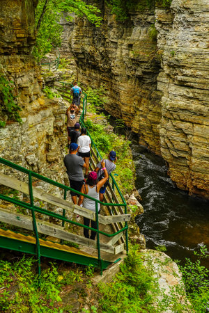AUSABLE CHASM, NEW YORK - AUGUST 22, 2020: Visitors descending all the way down inside of the chasm...