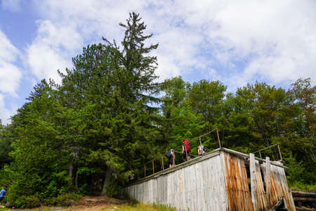KEENE, NEW YORK - AUGUST 21, 2020: Tourists at the Avalanche Lake Trial in the High Peaks Wilderness Area of the Adirondack State Park in Upstate New Yorkのeditorial素材