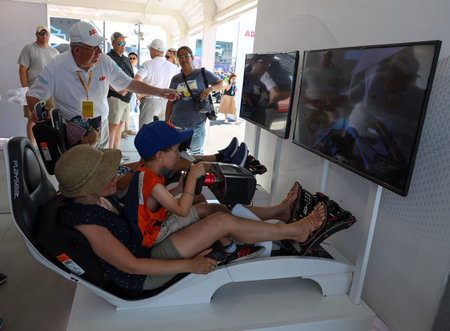 NEW YORK - JULY 13, 2019: Gamers enjoy Playseat Formula E new racing simulator inside the Gaming...