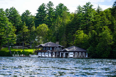 LAKE PLACID, NEW YORK - AUGUST 20, 2020: Luxury boathouse on Lake Placid in New York State's Adirondack Mountainsのeditorial素材