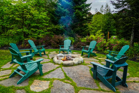 Adirondack Chairs around fire pitの写真素材