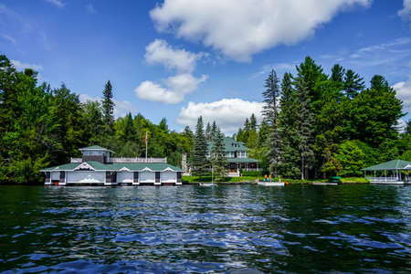 LAKE PLACID, NEW YORK - AUGUST 20, 2020: Luxury boathouse on Lake Placid in New York State's Adirondack Mountainsのeditorial素材