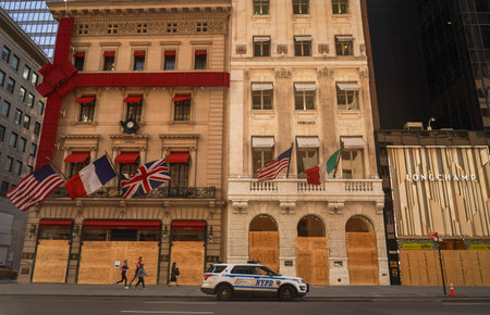 NEW YORK - NOVEMBER 5, 2020: Cartier and Versace luxury retailer stores at 5th Avenue boarded up in...