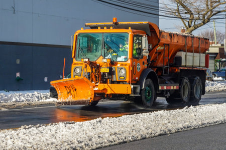 BROOKLYN, NEW YORK - DECEMBER 17, 2020: New York Department of Sanitation truck cleaning streets in Brooklyn, NY after massive Winter Storm Gailのeditorial素材