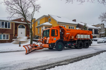 BROOKLYN, NEW YORK - DECEMBER 17, 2020: New York Department of Sanitation truck cleaning streets in Brooklyn, NY after massive Winter Storm Gailのeditorial素材