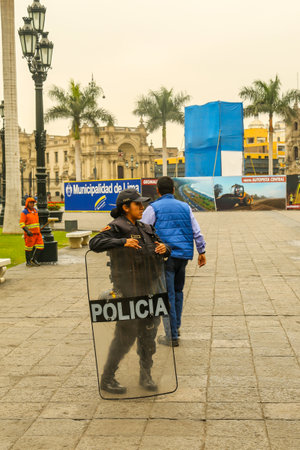 LIMA, PERU - SEPTEMBER 29, 2016: Police officer provides security near Plaza de Armas in Lima, Peruのeditorial素材