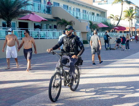 HOLLYWOOD BEACH, FLORIDA - JANUARY 2, 2021:  Police officer provides security at Hollywood Beach...