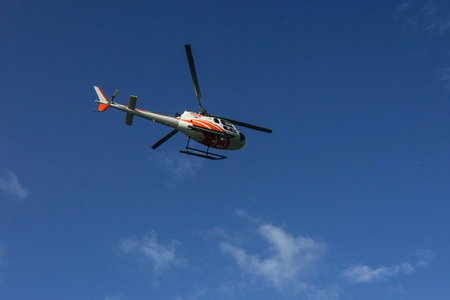 ST. BARTS, FRENCH WEST INDIES - FEBRUARY 3, 2021: West Indies Helicopter landing at Remy de Haenen Airport also known as Saint Barthelemy Airportのeditorial素材