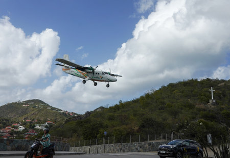 ST. BARTS, FRENCH WEST INDIES - FEBRUARY 4, 2021: St. Barth  Commuter plane landing at Remy de...