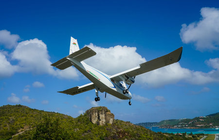 ST. BARTS, FRENCH WEST INDIES - FEBRUARY 4, 2021: Trans Anguilla Airways plane landing at Remy de...