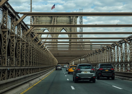 NEW YORK - MARCH 16, 2021: Crossing the Brooklyn Bridge.