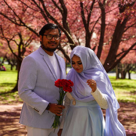 FLUSHING, NEW YORK - APRIL 8, 2021: Newlywed couple from Bangladesh in Flushing Meadows Parkのeditorial素材