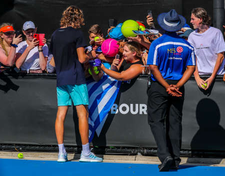 MELBOURNE, AUSTRALIA - JANUARY 22, 2019: Professional tennis player Stefanos Tsitsipas of Greece signs autographs after practice for the 2019 Australian Open in Melbourne Parkのeditorial素材