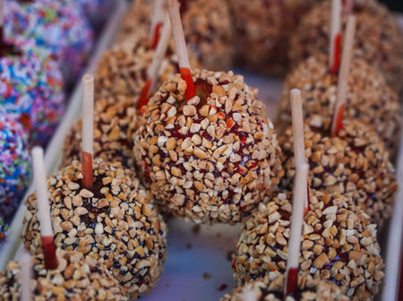 World famous Red Candy Apple with granulated nuts