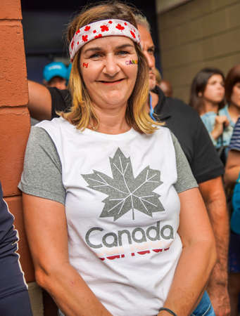NEW YORK - SEPTEMBER 7, 2019: Canadian tennis fan at the Arthur Ashe Stadium at Billie Jean King National Tennis Center during women's final match at the 2019 US Open in New Yorkのeditorial素材