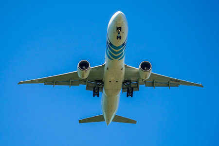 NEW YORK - JUNE 24, 2021: EgyptAir Boeing 777 descends for landing at JFK International Airport in...