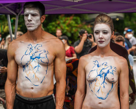 NEW YORK - JULY 25, 2021: Artists paint fully nude models of all shapes and sizes during 8th NYC Body Painting Day featuring artist Andy Golub at Union Square in New Yorkのeditorial素材