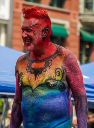 NEW YORK - JULY 25, 2021: Artists paint fully nude models of all shapes and sizes during 8th NYC Body Painting Day featuring artist Andy Golub at Union Square in New Yorkのeditorial素材