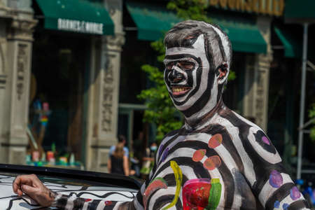 NEW YORK - JULY 25, 2021: Artists paint fully nude models of all shapes and sizes during 8th NYC Body Painting Day featuring artist Andy Golub at Union Square in New Yorkのeditorial素材