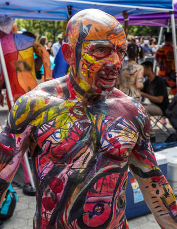 NEW YORK - JULY 25, 2021: Artists paint fully nude models of all shapes and sizes during 8th NYC Body Painting Day featuring artist Andy Golub at Union Square in New Yorkのeditorial素材