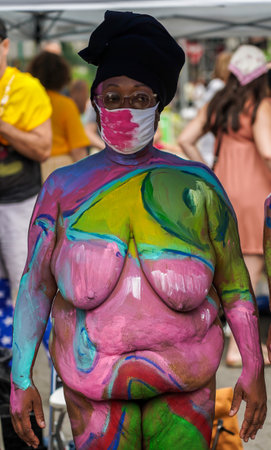 NEW YORK - JULY 25, 2021: Artists paint fully nude models of all shapes and sizes during 8th NYC Body Painting Day featuring artist Andy Golub at Union Square in New Yorkのeditorial素材