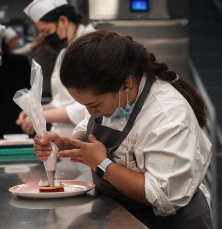 NEW YORK - JULY 29, 2021: Pastry Sous Chef Maria Arroyo in the kitchen of newest Micheline Star Chef Daniel Boulud's restaurant Le Pavillon in Midtown Manhattanのeditorial素材