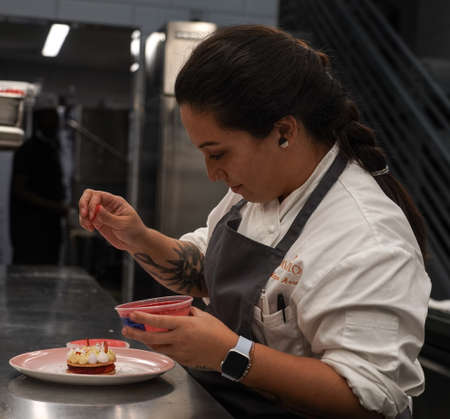 NEW YORK - JULY 29, 2021: Pastry Sous Chef Maria Arroyo in the kitchen of newest Micheline Star Chef Daniel Boulud's restaurant Le Pavillon in Midtown Manhattanのeditorial素材