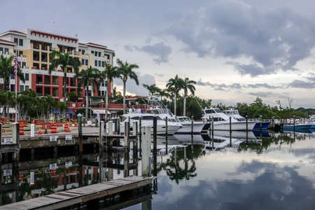 JUPITER, FLORIDA - APRIL 19, 2021: Boats dock in front of condominium on the Intracoastal Waterway in Jupiter, Floridaのeditorial素材