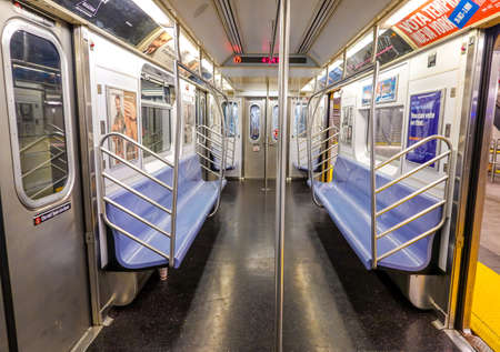 NEW YORK - OCTOBER 22, 2019: Inside of NYC Subway Car at 34 Street - Hudson Yards Station in Manhattan. Owned by the NYC Transit Authority, the subway system has 469 stations in operationのeditorial素材